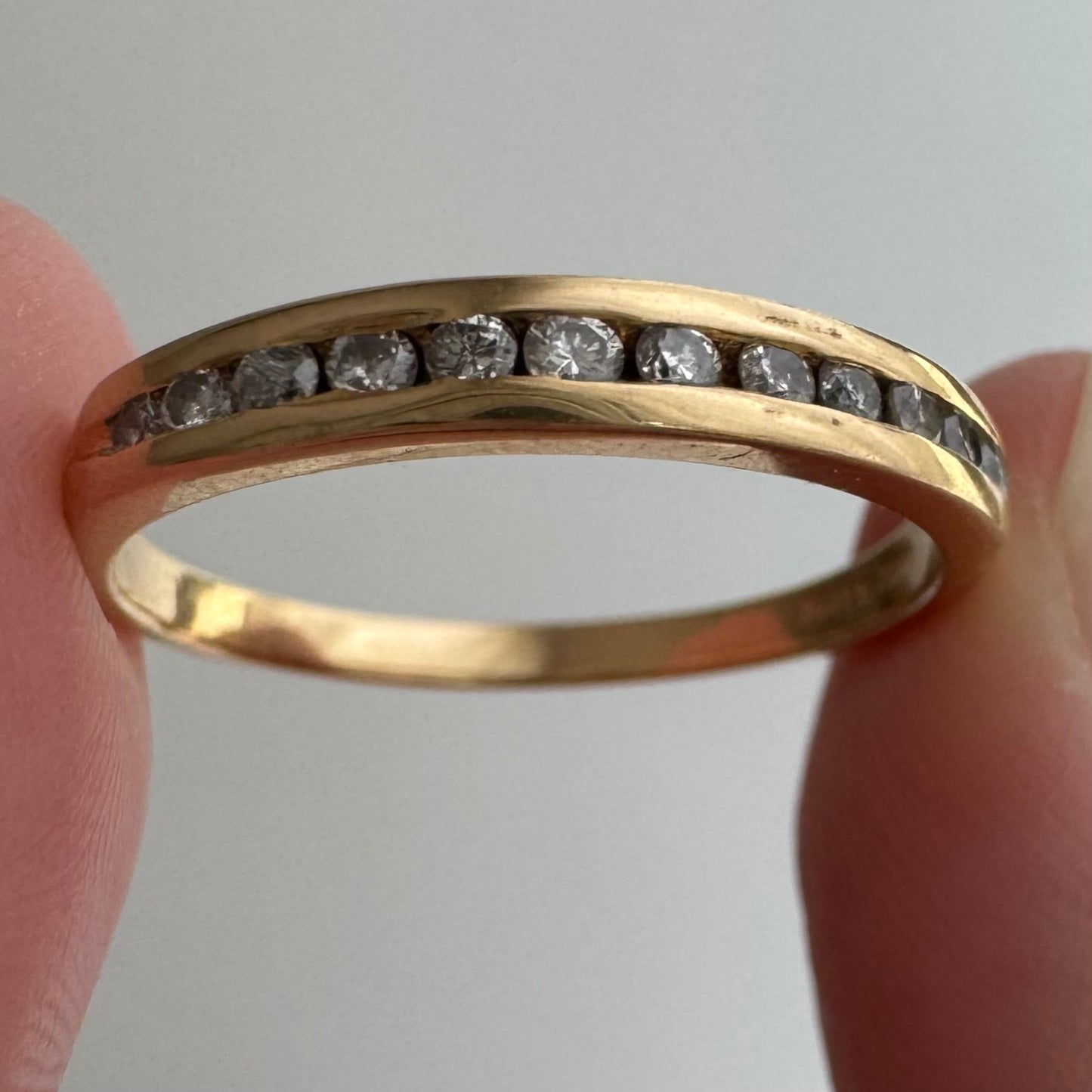V I N T A G E // a dozen sparkles / 14k yellow gold and 12 channel set diamond half eternity band / size 7.75