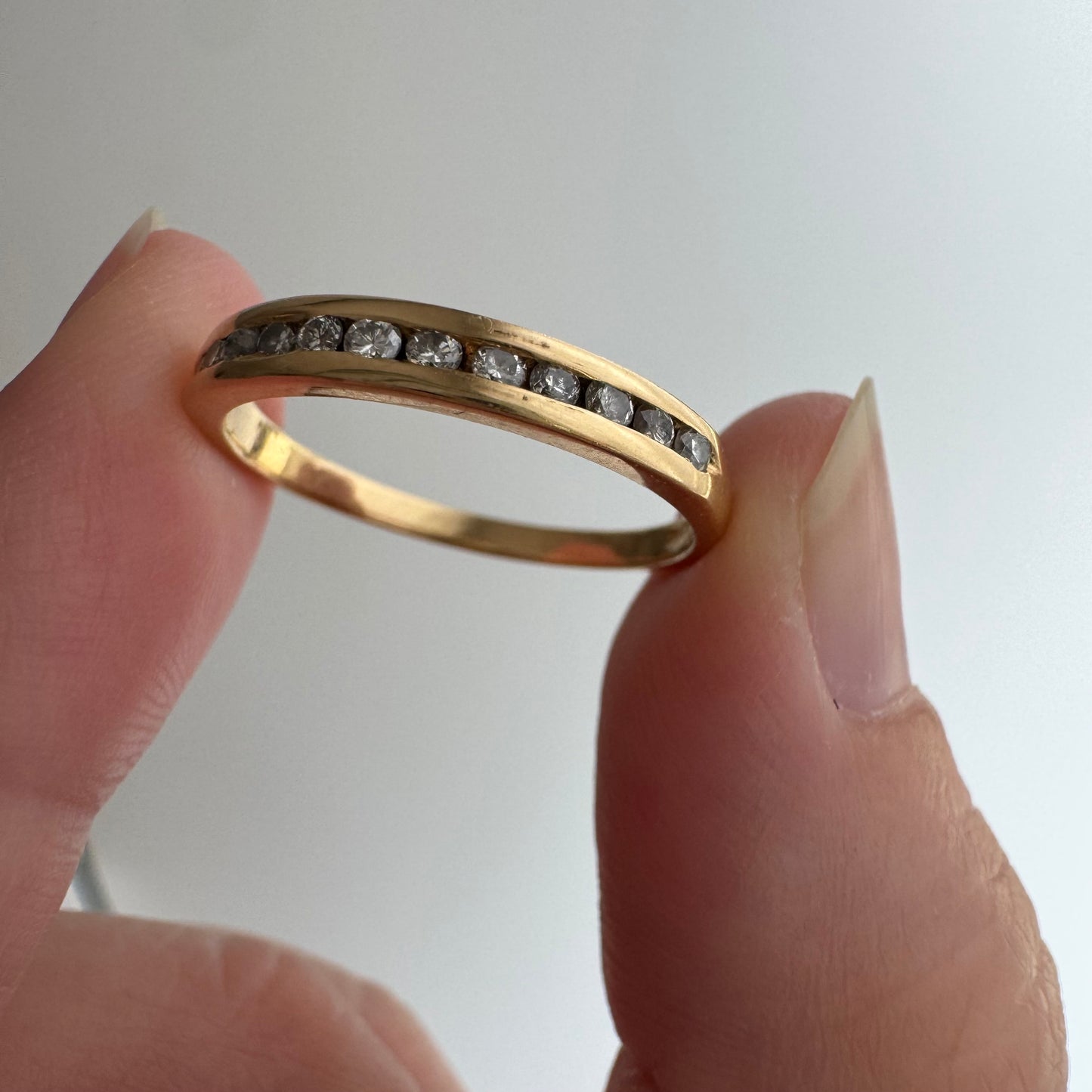 V I N T A G E // a dozen sparkles / 14k yellow gold and 12 channel set diamond half eternity band / size 7.75