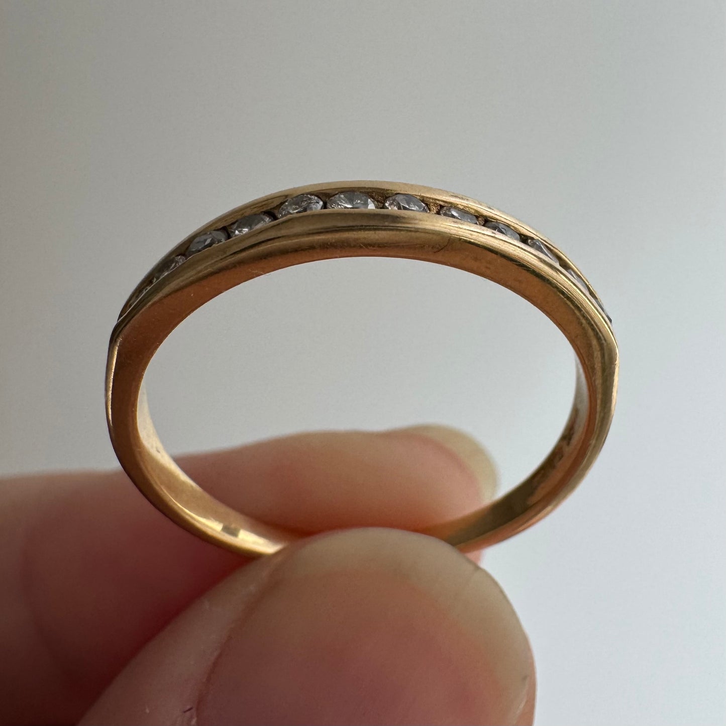 V I N T A G E // a dozen sparkles / 14k yellow gold and 12 channel set diamond half eternity band / size 7.75
