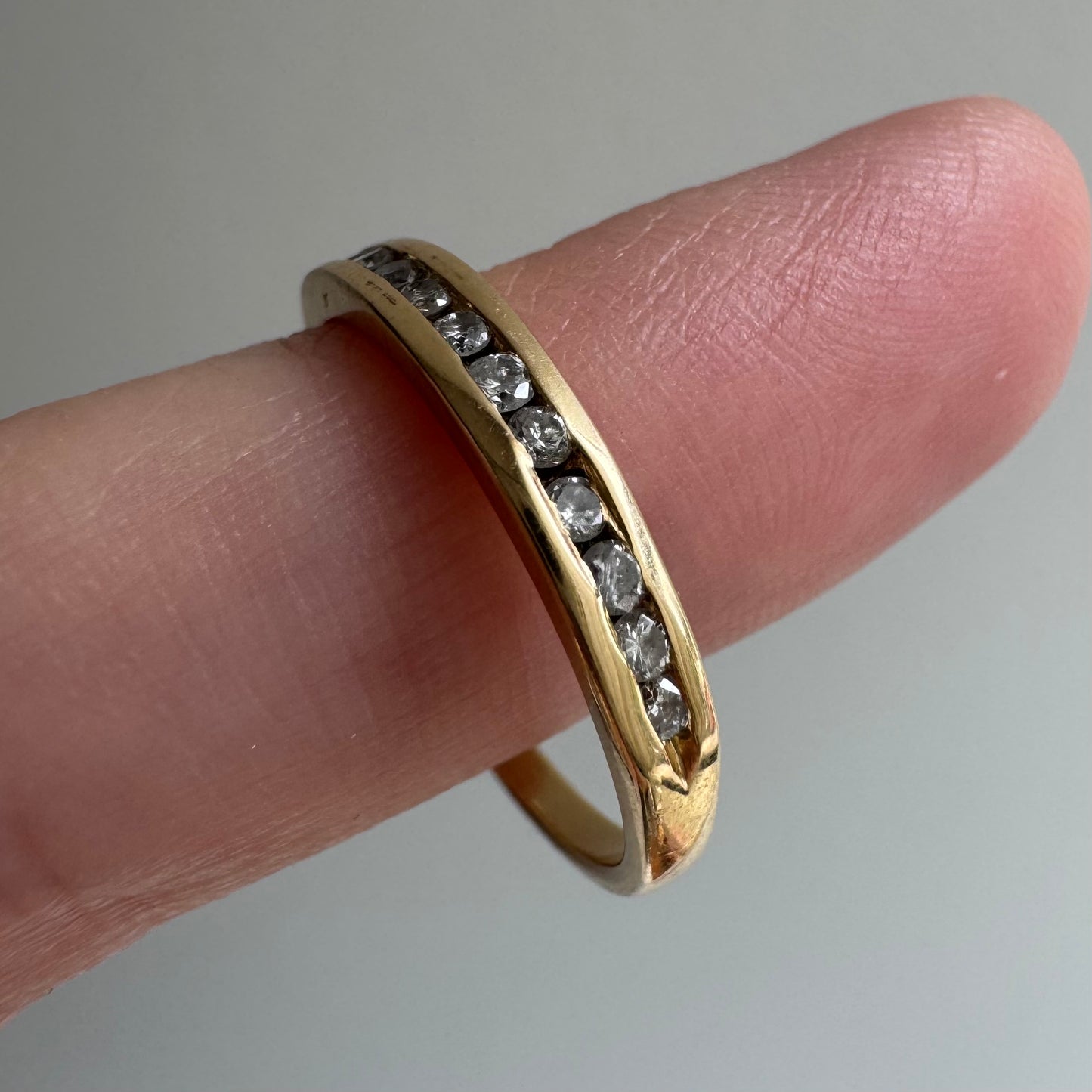 V I N T A G E // a dozen sparkles / 14k yellow gold and 12 channel set diamond half eternity band / size 7.75