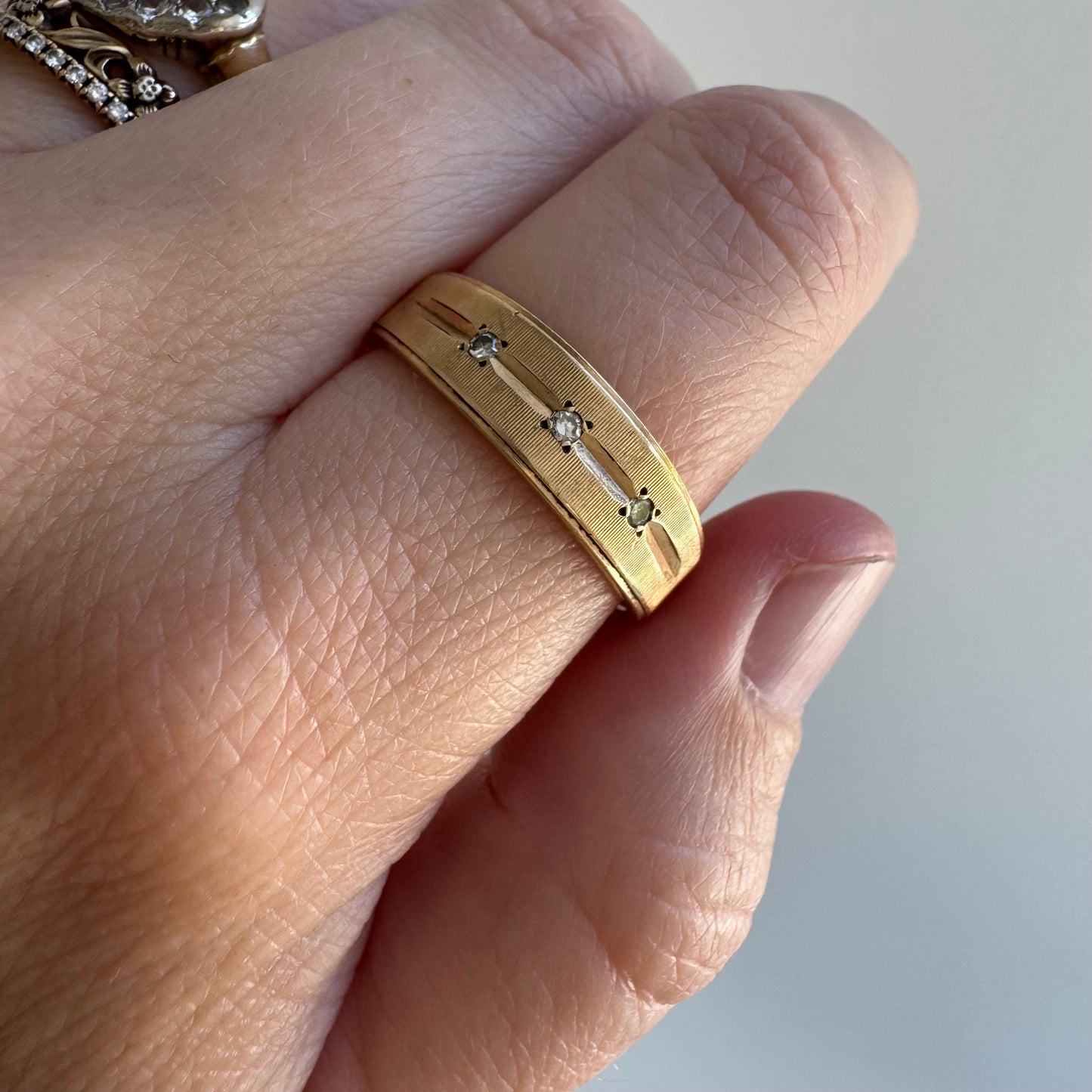V I N T A G E // subtle stars / 14k and diamond trilogy half eternity tapered wide band / size ~8.75