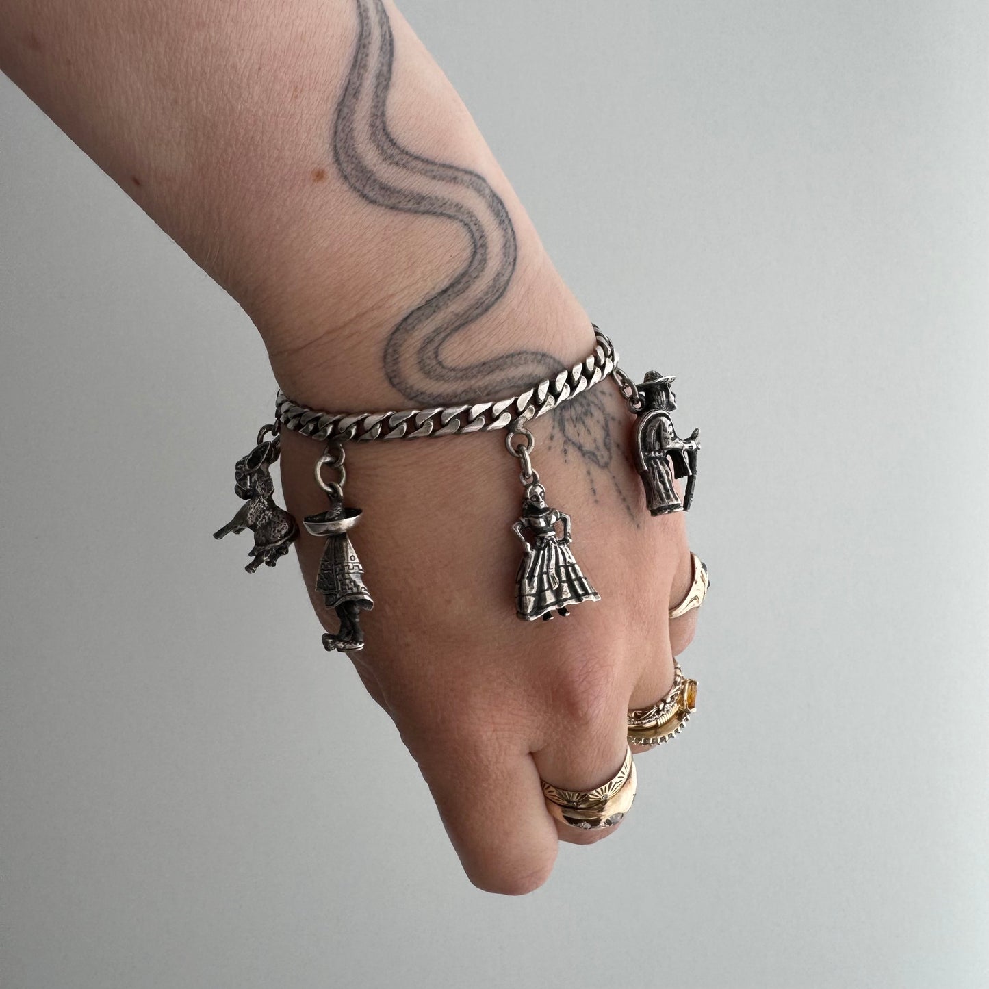 V I N T A G E // many milagros / sterling silver older Mexican charm bracelet / 6.5", 52.3g