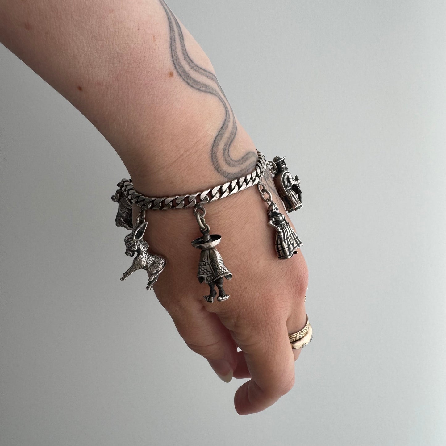V I N T A G E // many milagros / sterling silver older Mexican charm bracelet / 6.5", 52.3g