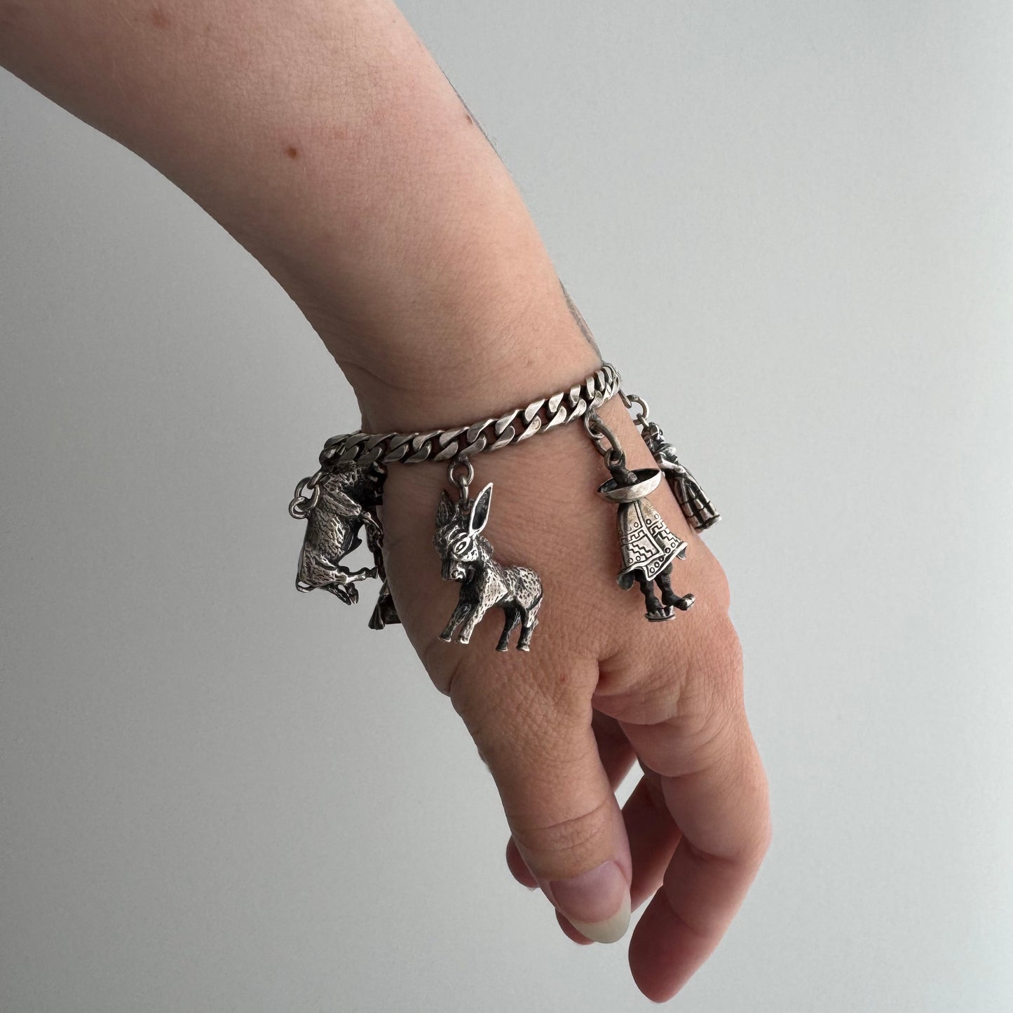 V I N T A G E // many milagros / sterling silver older Mexican charm bracelet / 6.5", 52.3g