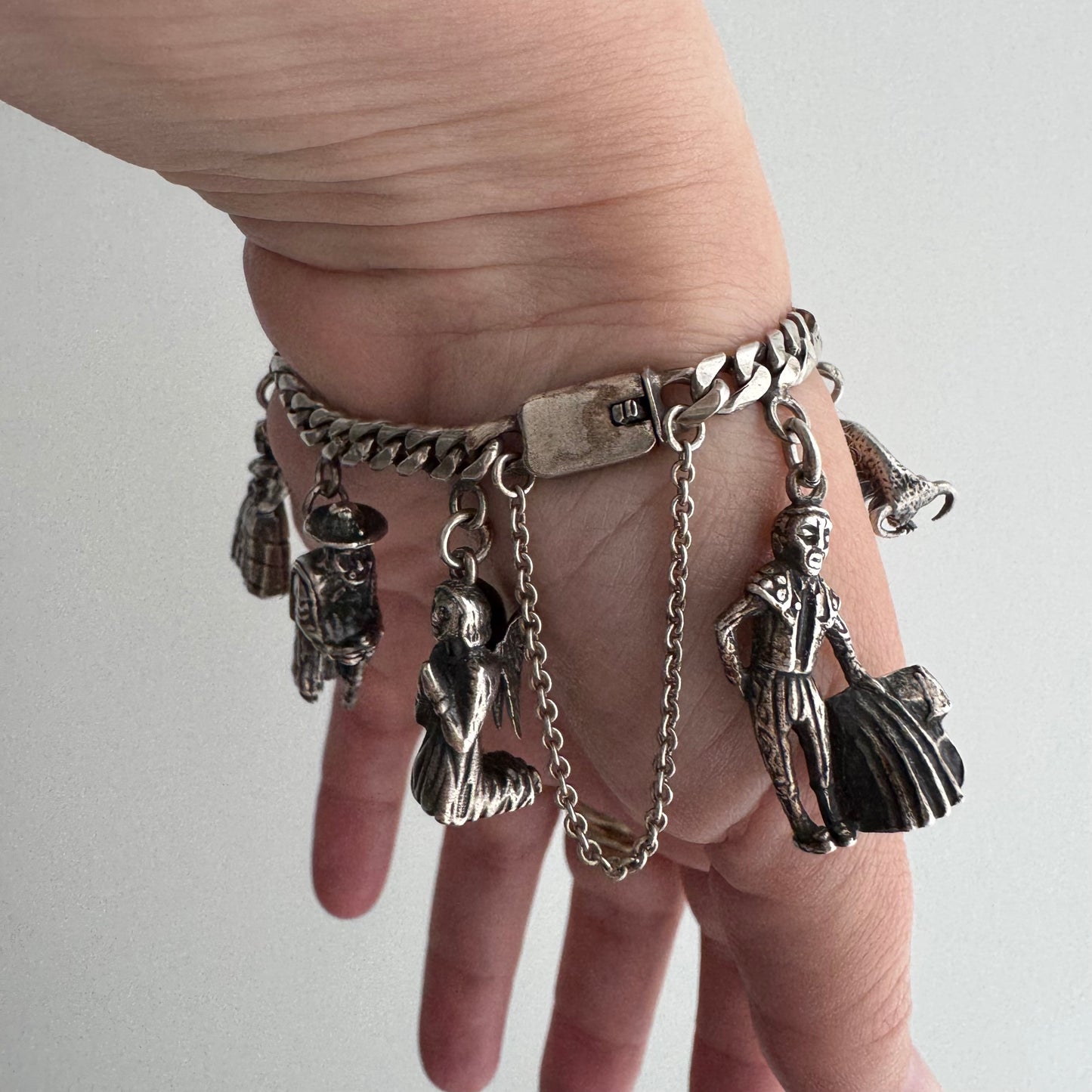 V I N T A G E // many milagros / sterling silver older Mexican charm bracelet / 6.5", 52.3g