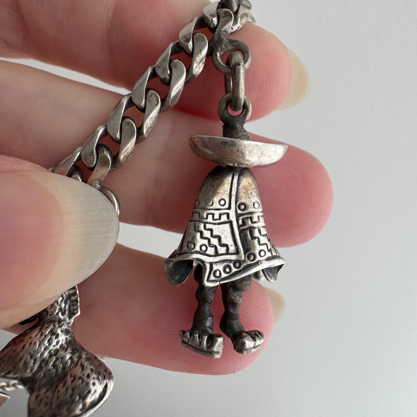 V I N T A G E // many milagros / sterling silver older Mexican charm bracelet / 6.5", 52.3g