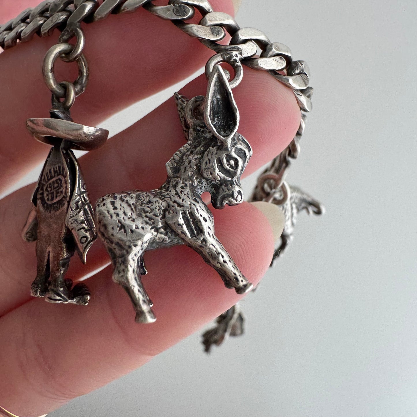 V I N T A G E // many milagros / sterling silver older Mexican charm bracelet / 6.5", 52.3g