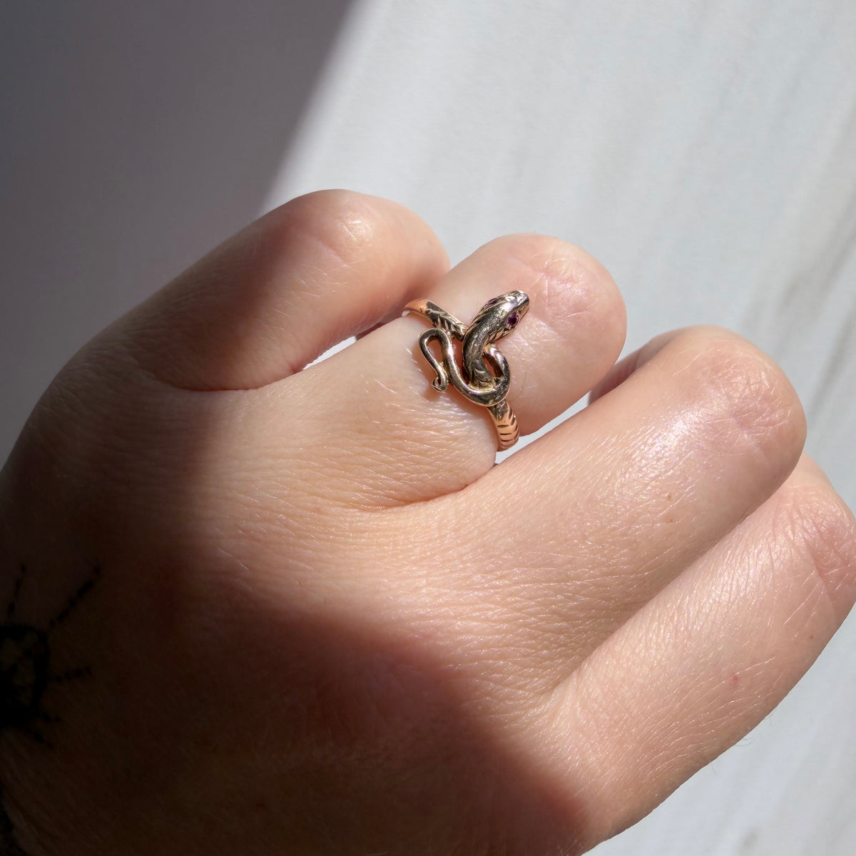 V I N T A G E // knotted embrace / 10k yellow gold snake ring with ruby eyes / size 4.5