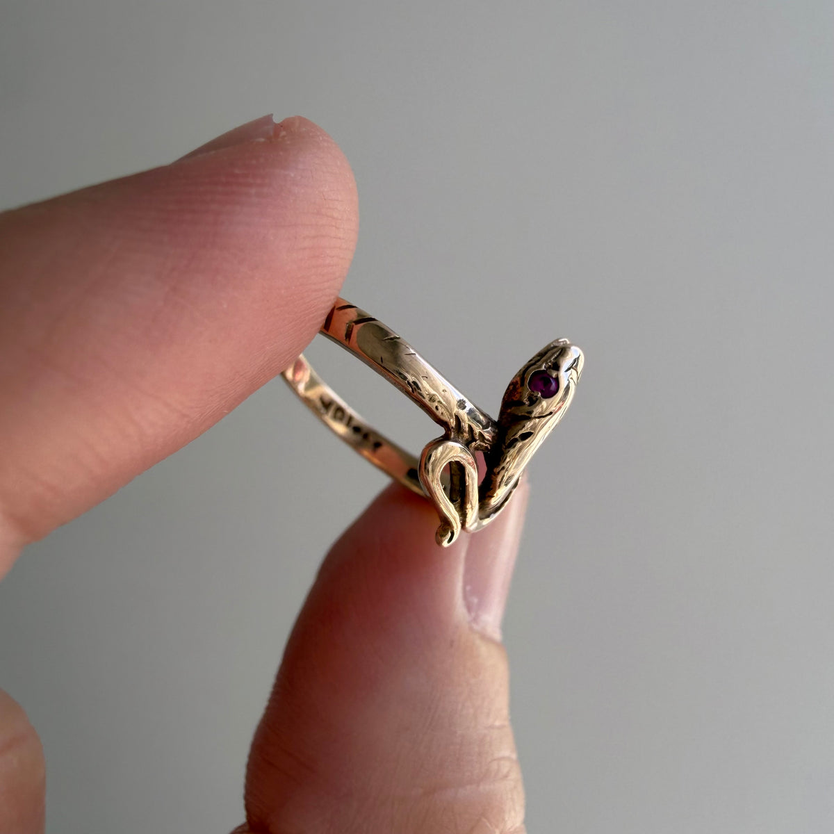 V I N T A G E // knotted embrace / 10k yellow gold snake ring with ruby eyes / size 4.5