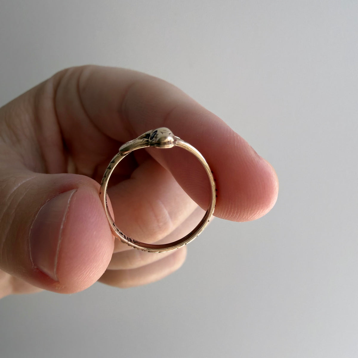 V I N T A G E // knotted embrace / 10k yellow gold snake ring with ruby eyes / size 4.5