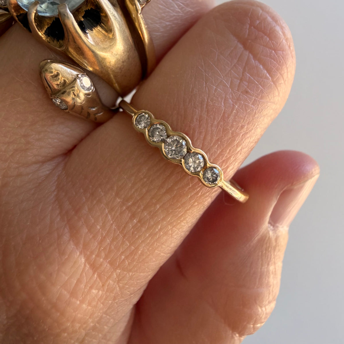 E S T A T E // bubble row / 14k yellow gold and channel set graduated diamond five stone band / size 10.25