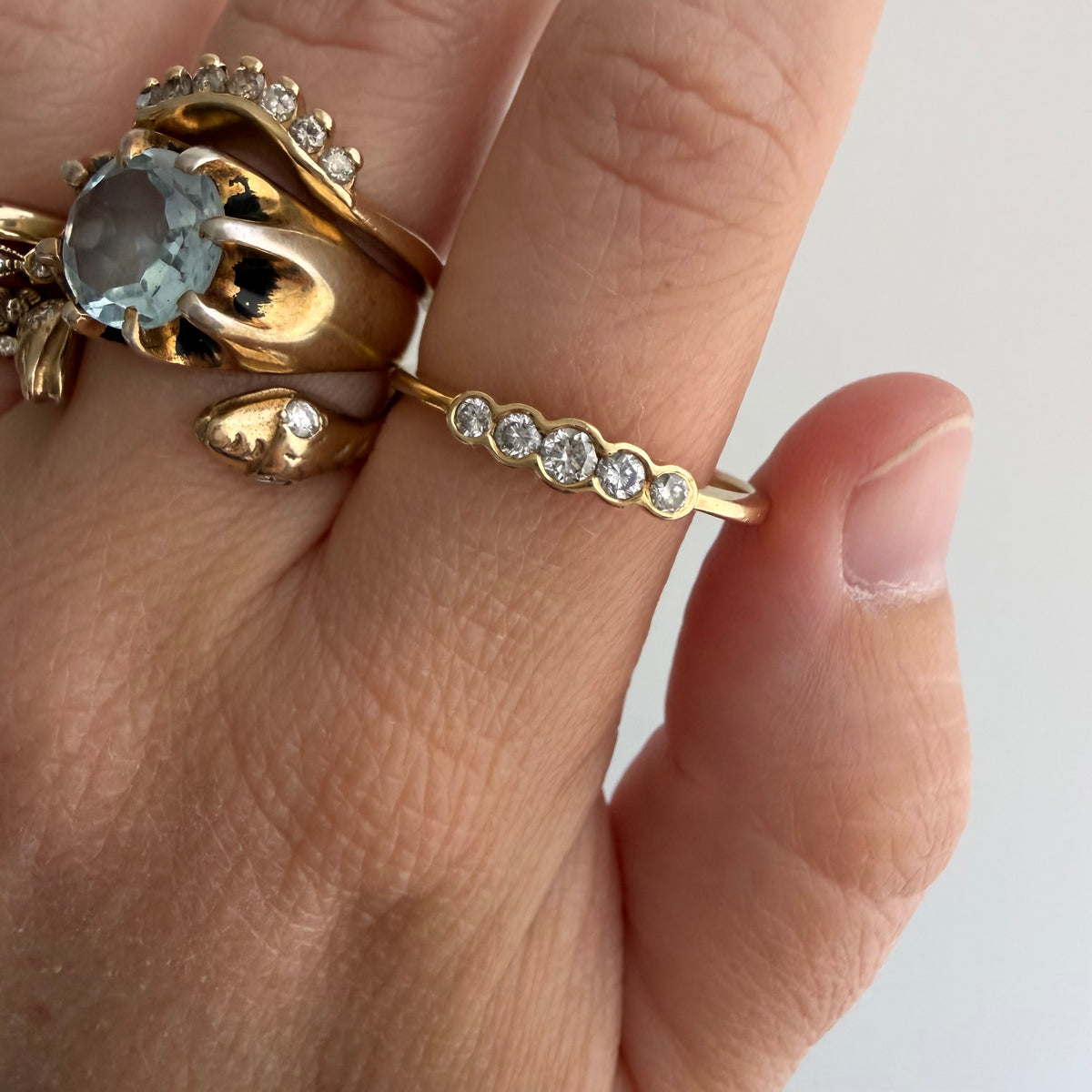 E S T A T E // bubble row / 14k yellow gold and channel set graduated diamond five stone band / size 10.25